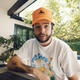 Matthew "Nadeshot" Haag sits at a desk at an outdoor office in Los Angeles.